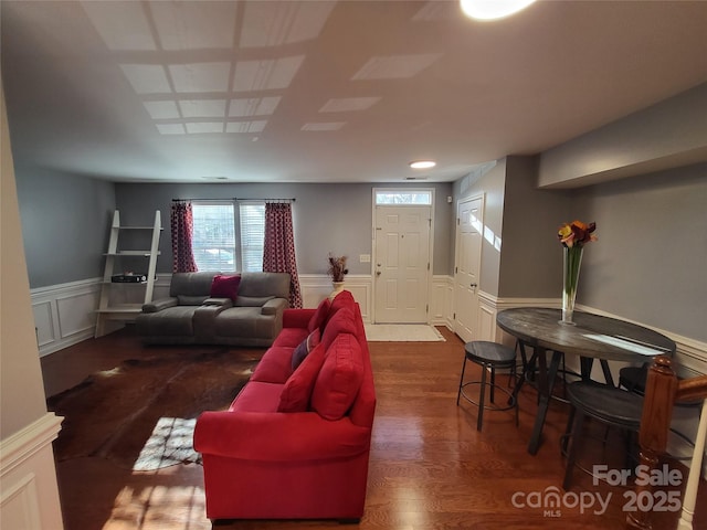 living room featuring dark wood-type flooring