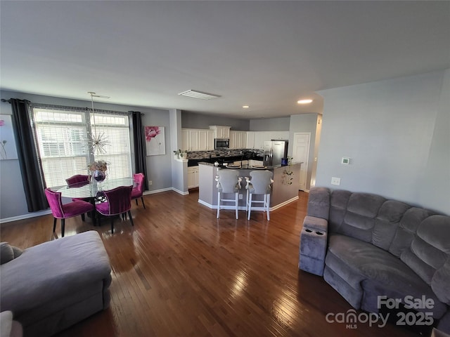 living room with dark hardwood / wood-style floors