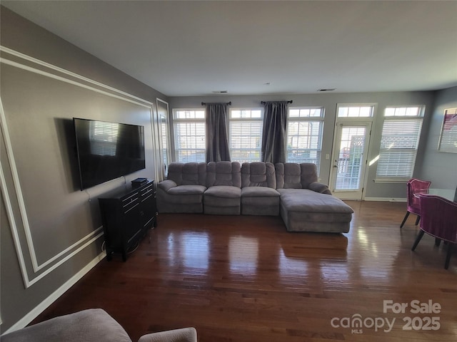 living room with dark hardwood / wood-style floors