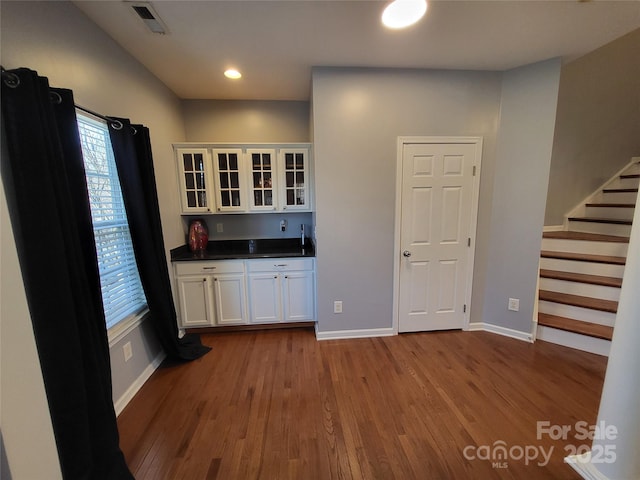 kitchen with white cabinetry and light wood-type flooring