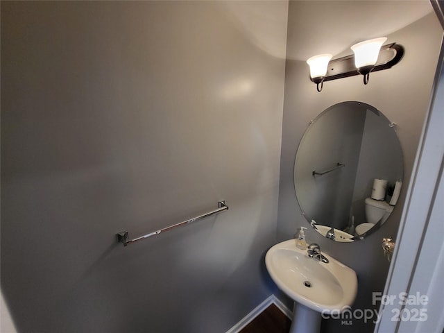 bathroom with toilet and sink