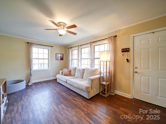 living room featuring ceiling fan, dark hardwood / wood-style floors, and ornamental molding