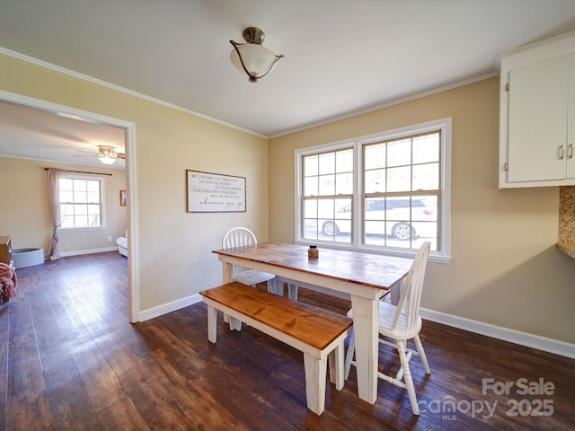 dining area with dark hardwood / wood-style floors, ceiling fan, and crown molding