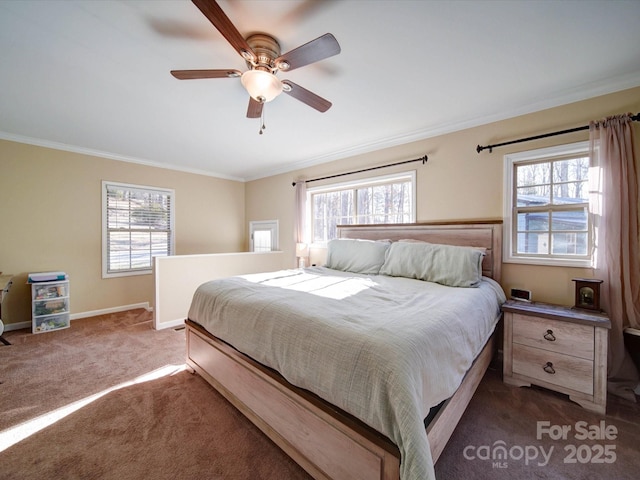 bedroom with ceiling fan, ornamental molding, and dark colored carpet