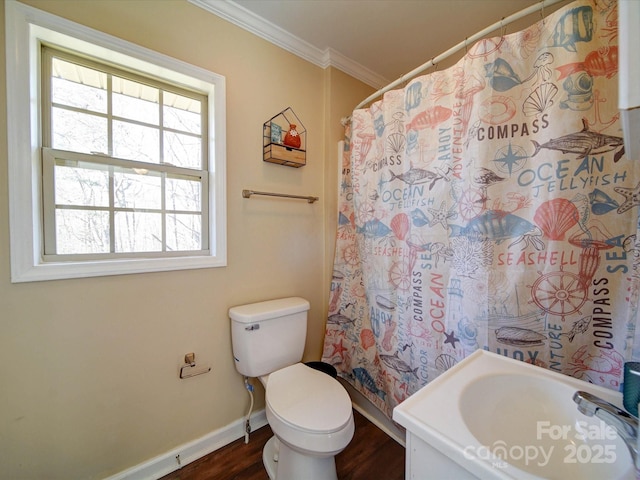 bathroom featuring hardwood / wood-style floors, curtained shower, toilet, and ornamental molding