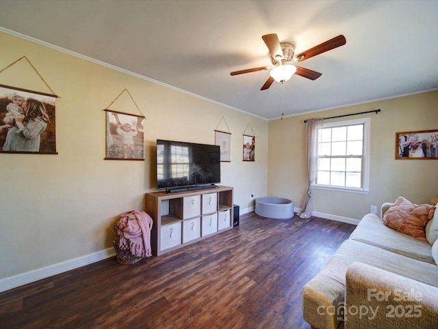 living room featuring ceiling fan, dark hardwood / wood-style flooring, and ornamental molding