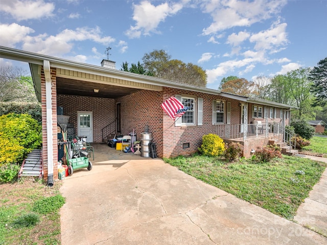 ranch-style home featuring a carport