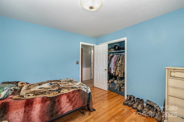 bedroom featuring a closet and light hardwood / wood-style flooring