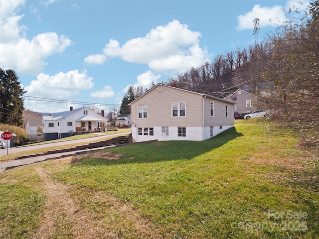 view of property exterior featuring a yard