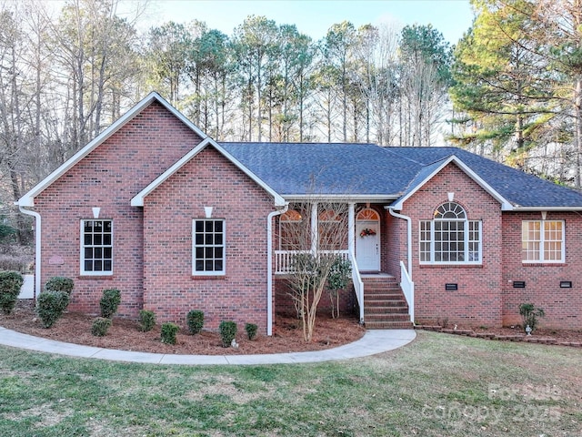 single story home featuring a front yard