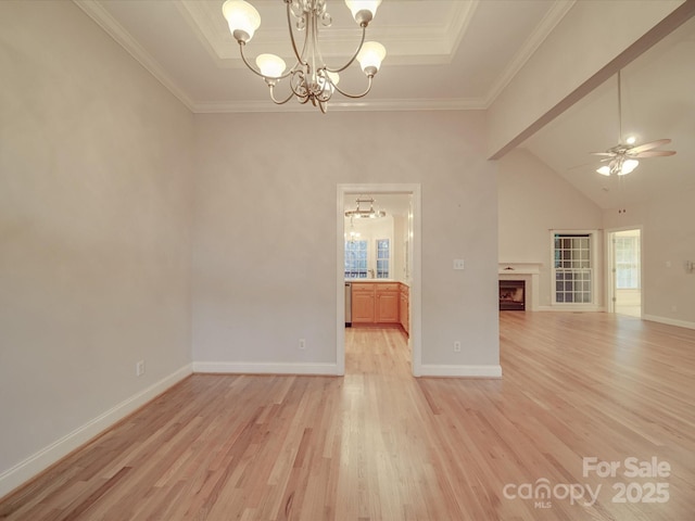 unfurnished living room with ceiling fan with notable chandelier, light wood-type flooring, and ornamental molding