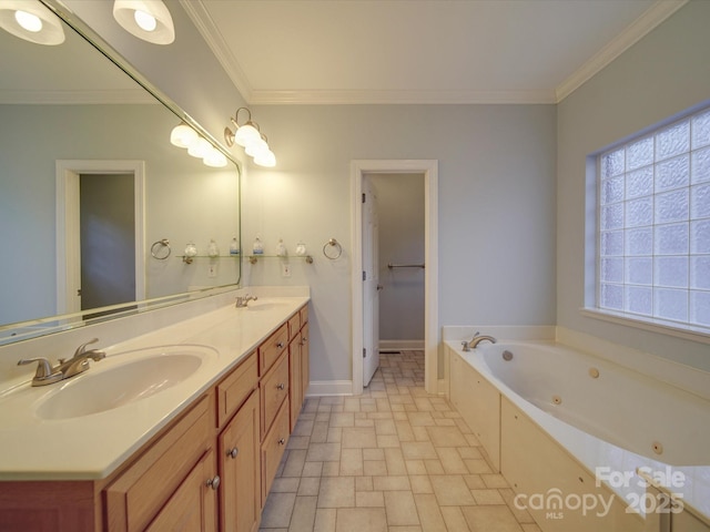 bathroom with a tub, vanity, and ornamental molding