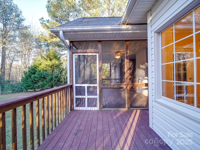 wooden terrace featuring a sunroom