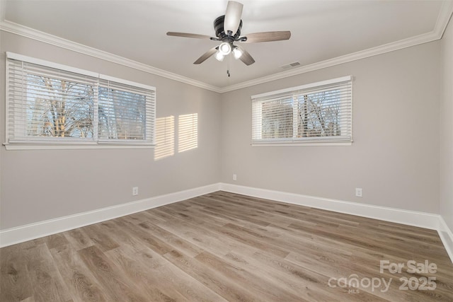 unfurnished room with crown molding, hardwood / wood-style floors, and ceiling fan