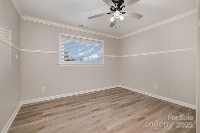 unfurnished room with crown molding, ceiling fan, and light wood-type flooring