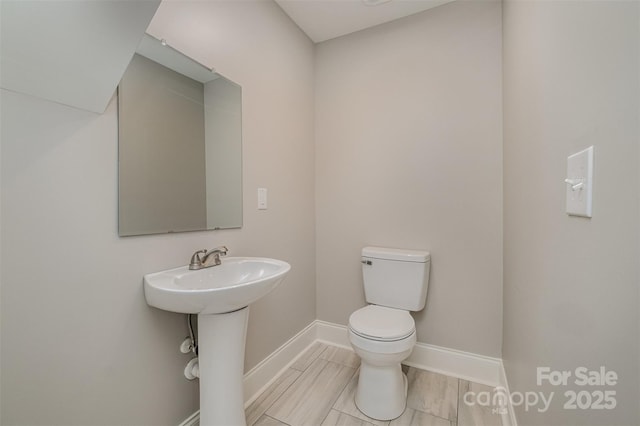 bathroom with toilet and sink