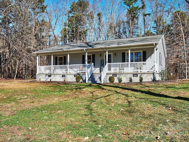 ranch-style house with a front yard and a porch