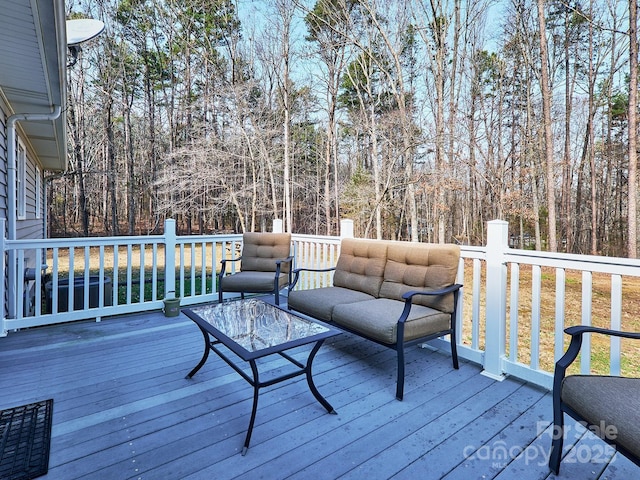 wooden deck with outdoor lounge area