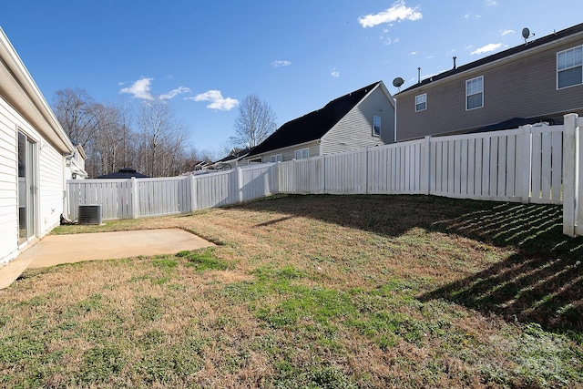 view of yard featuring a patio and central AC