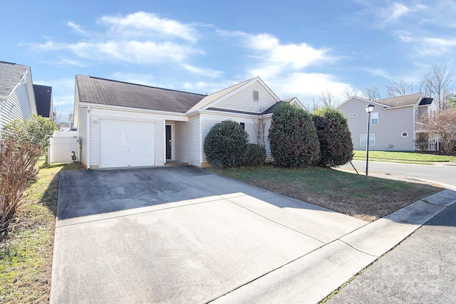 view of front of property with a front lawn and a garage