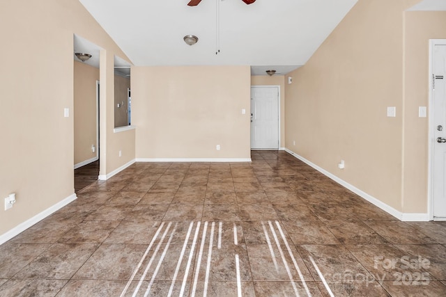 spare room with ceiling fan and lofted ceiling