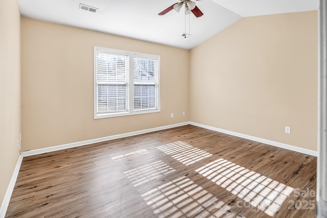 unfurnished room featuring wood-type flooring, vaulted ceiling, and ceiling fan