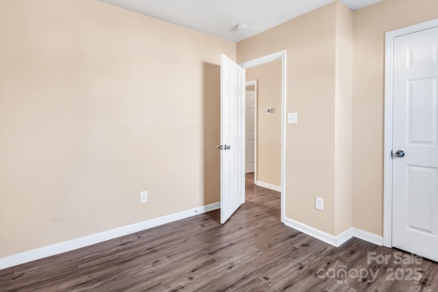 unfurnished bedroom featuring hardwood / wood-style floors