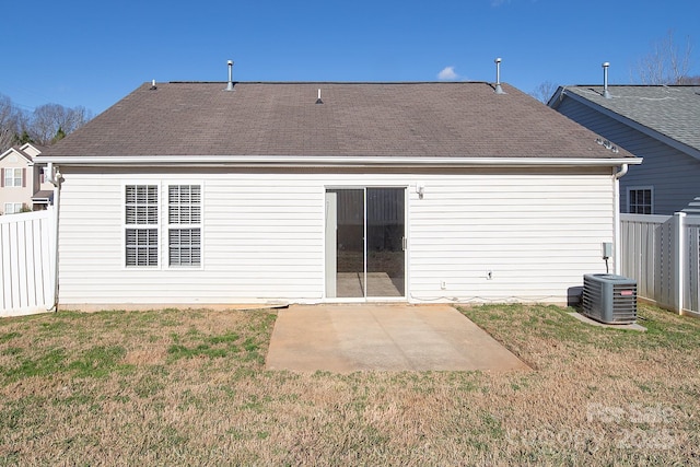 back of house featuring a lawn, cooling unit, and a patio