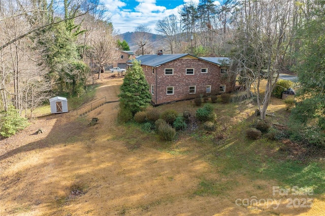 drone / aerial view featuring a mountain view