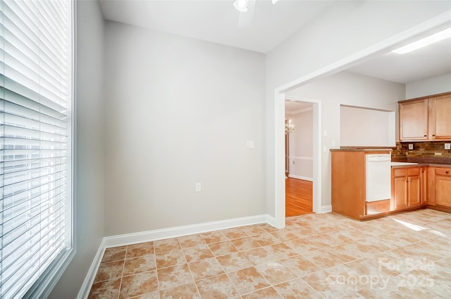 kitchen with decorative backsplash, ceiling fan with notable chandelier, dishwasher, and light tile patterned flooring