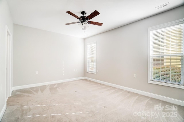 carpeted empty room with ceiling fan