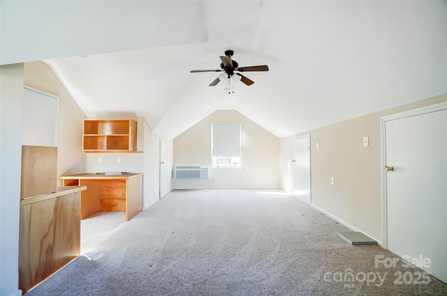 bonus room with a wall mounted AC, ceiling fan, light colored carpet, and lofted ceiling