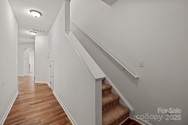 stairway with wood-type flooring