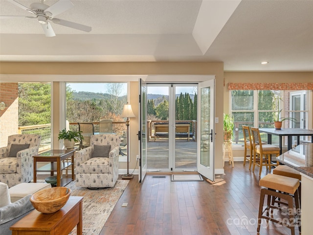 entryway with ceiling fan, dark hardwood / wood-style floors, and french doors