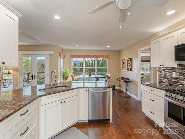 kitchen with white cabinetry, sink, and stainless steel appliances