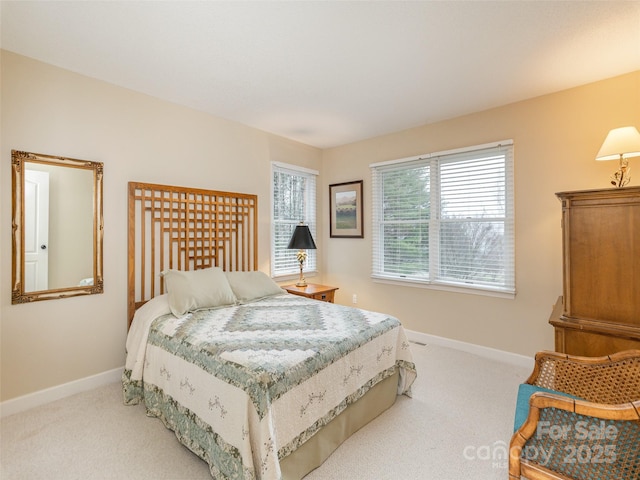 bedroom featuring light colored carpet