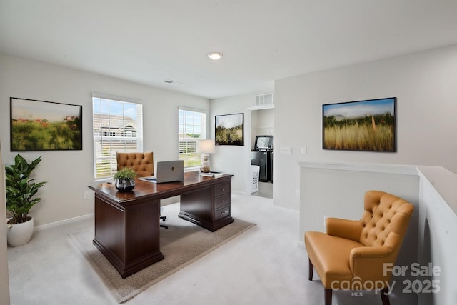 office space with light colored carpet