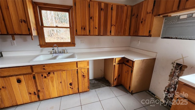 kitchen featuring sink and light tile patterned floors