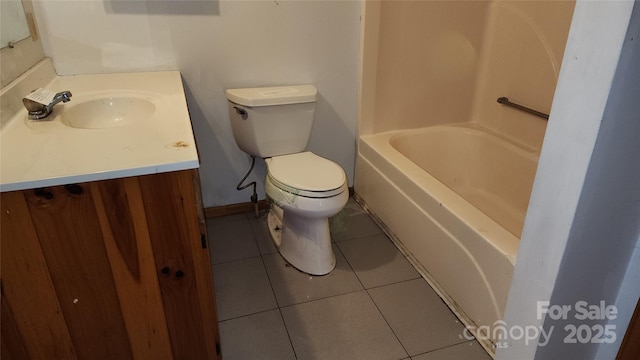 bathroom with toilet, a tub, tile patterned flooring, and vanity