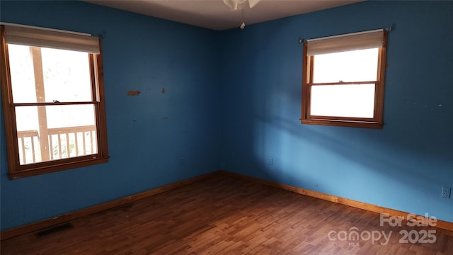 empty room featuring hardwood / wood-style flooring