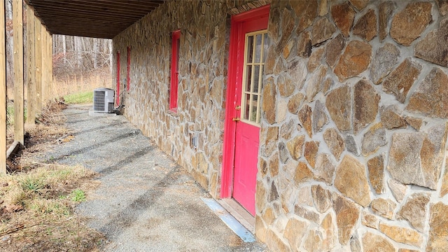 entrance to property featuring central air condition unit