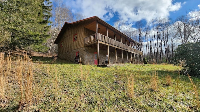 back of property with a balcony