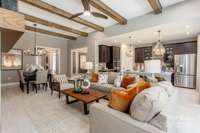 living room featuring beamed ceiling, ceiling fan with notable chandelier, and light hardwood / wood-style floors