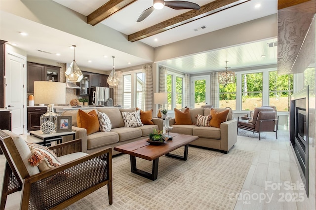 interior space featuring beam ceiling and ceiling fan