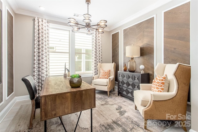 sitting room featuring a chandelier and crown molding