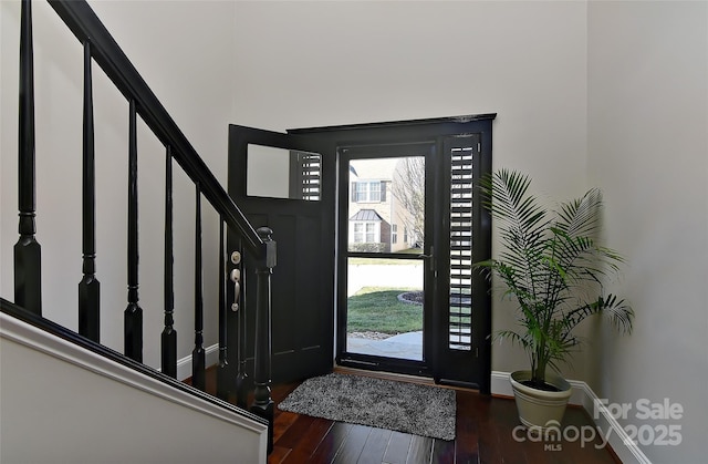 entryway with dark hardwood / wood-style floors