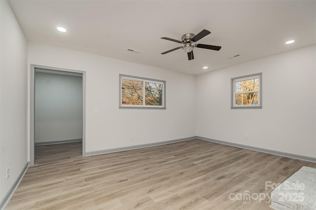 unfurnished room with light hardwood / wood-style flooring and ceiling fan