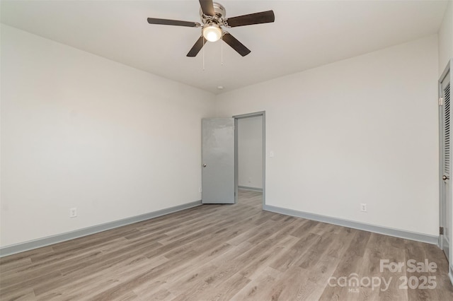 unfurnished room with ceiling fan and light hardwood / wood-style flooring