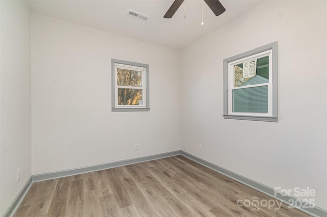 unfurnished room with light hardwood / wood-style flooring and ceiling fan