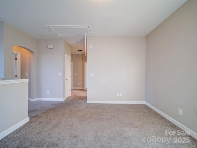 empty room featuring light colored carpet